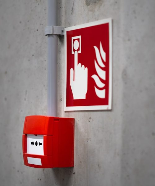 fire red button industrial interior concrete wall